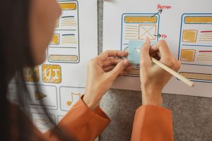 UI UX designers team working on new website wireframe in office